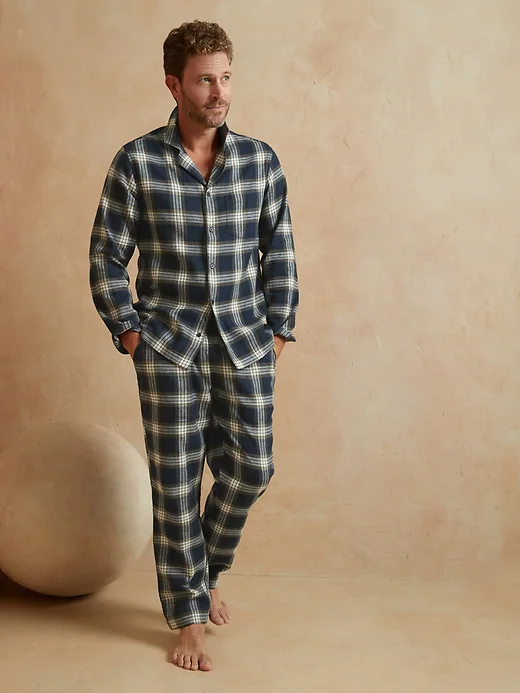 A man wearing plaid pajamas