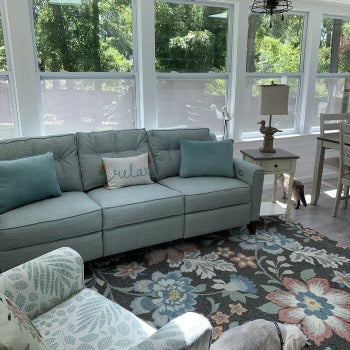 a reviewer's couch in blue