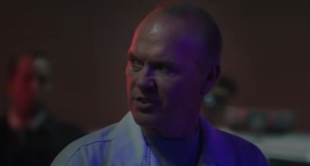 Adrian Toomes standing behind cops by a police car in "Morbius"