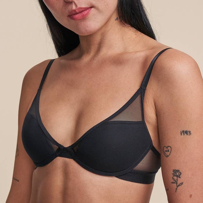 model wearing the bra with some mesh panels in black