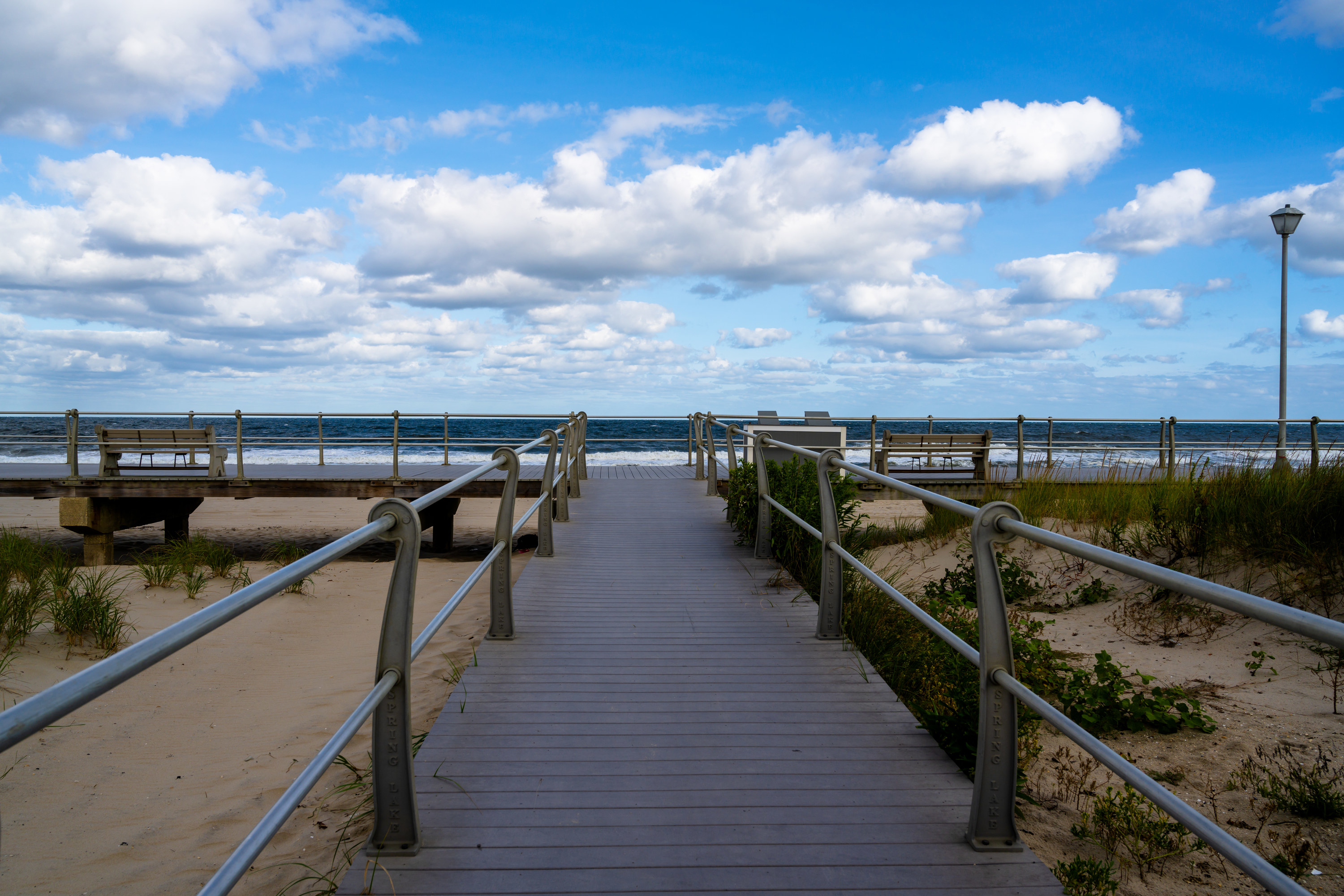 A scenic view of the boardwalk and beach in Spring Lake, New Jersey