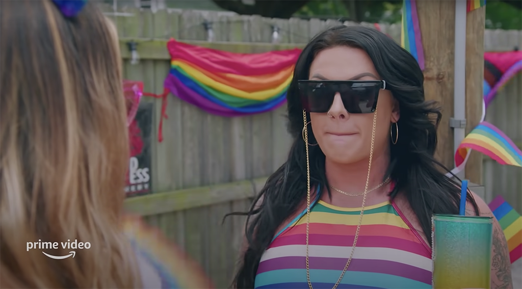 A cast member of &quot;Tampa Baes&quot; holds back her tongue during a conversation at a Pride party