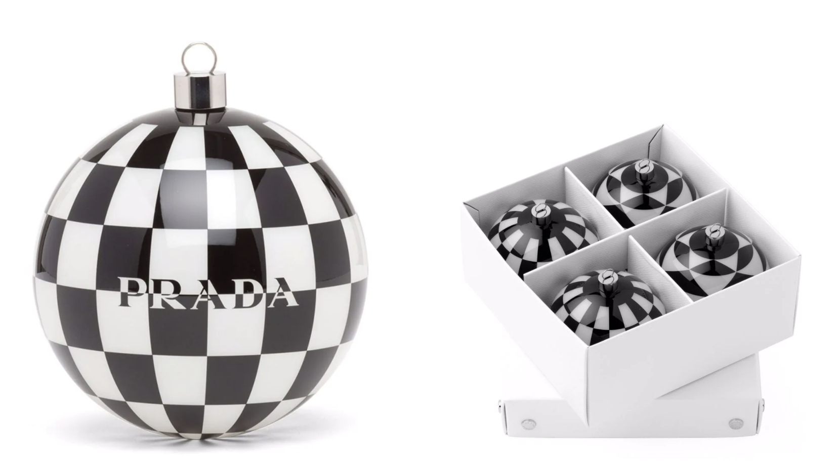The black and white Prada ornament next to a box filled with ornaments