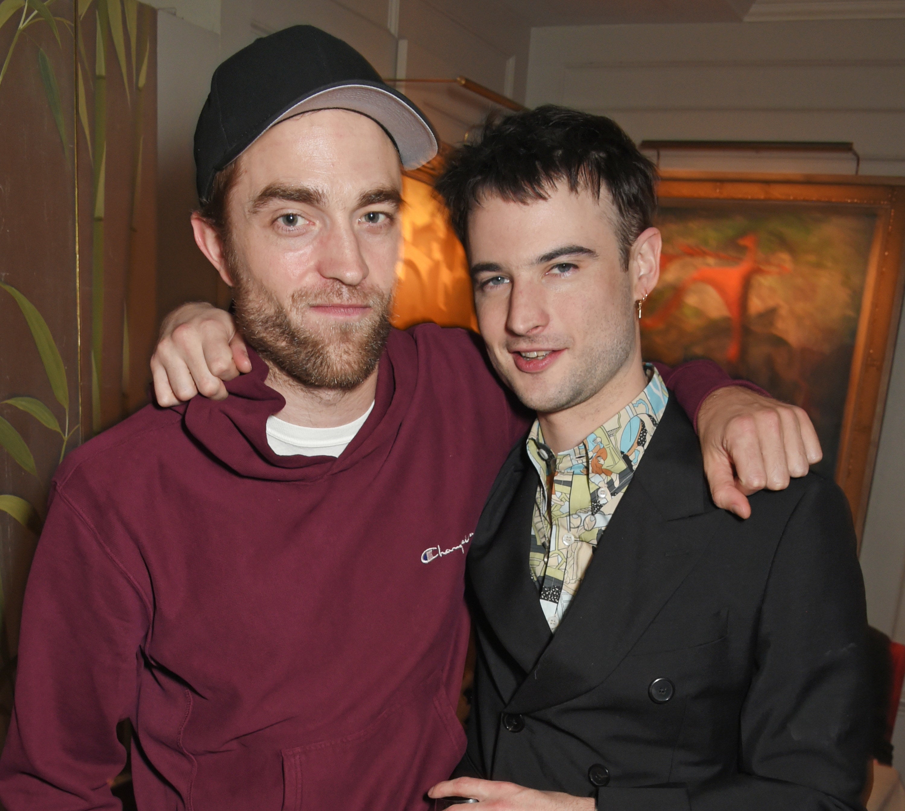 Photo of Robert Pattinson and Tom Sturridge at an event