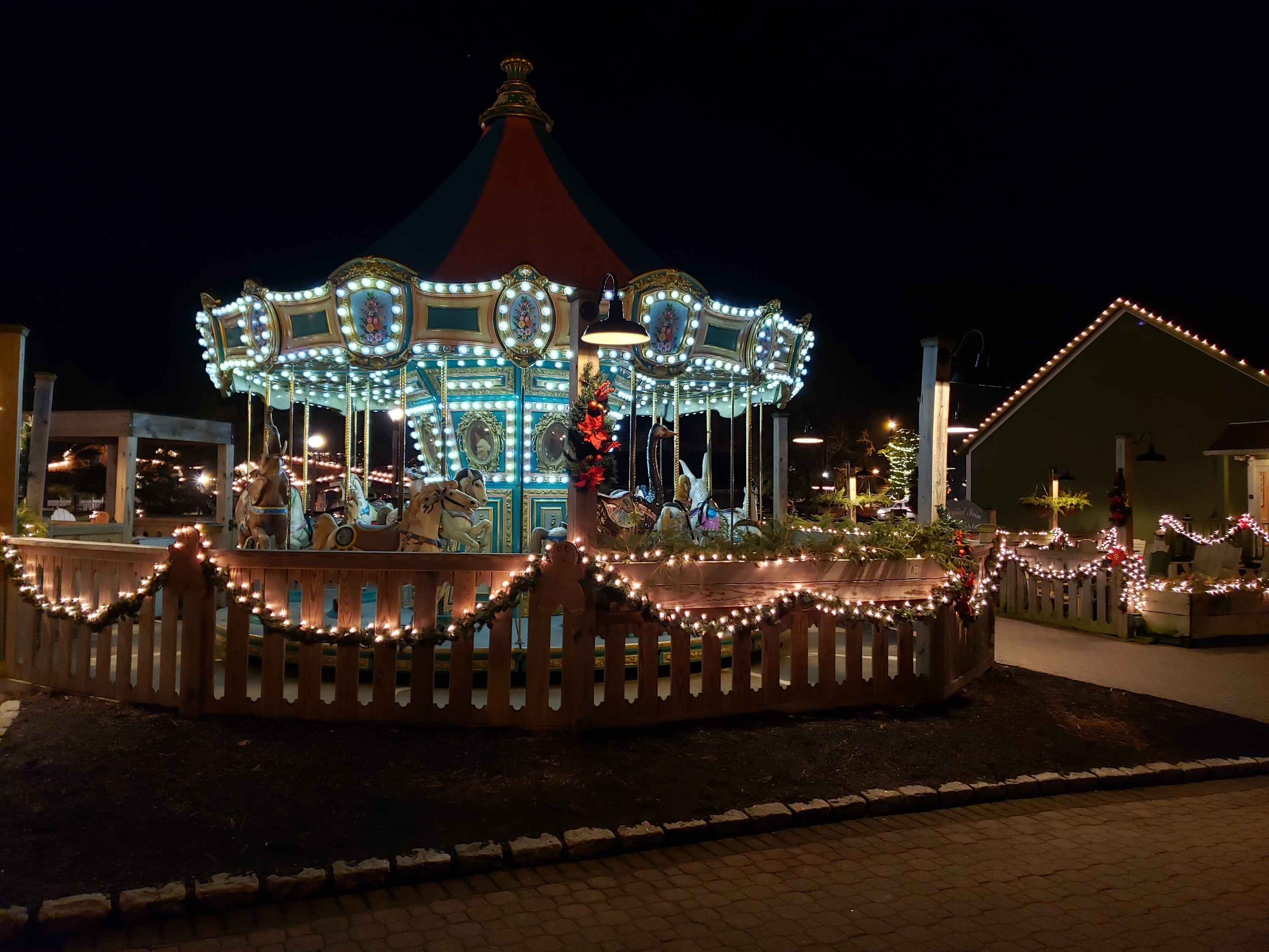 The Smithville Carousel decorated in lights at night