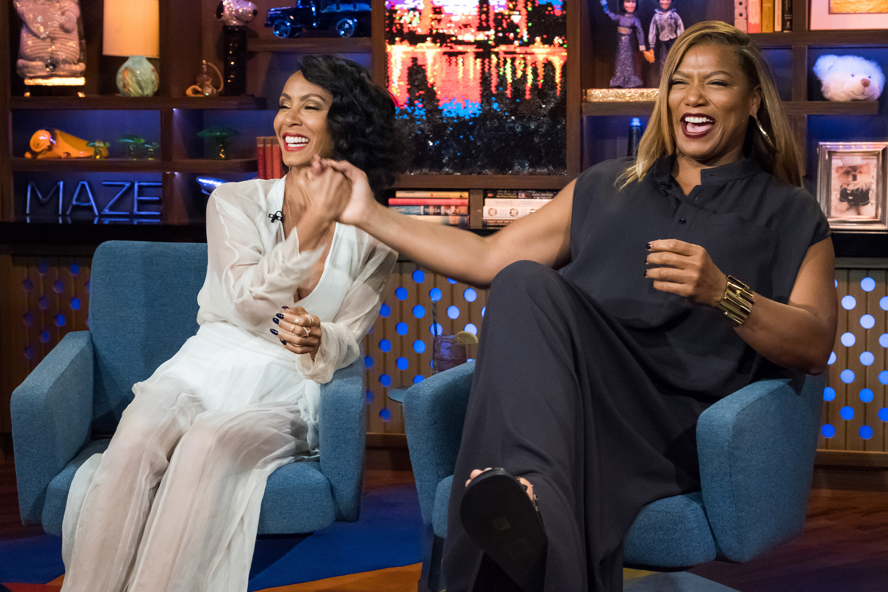 Photo of Jada Pinkett Smith and Queen Latifah laughing on a talk show