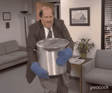 GIF of Kevin on the Office spilling his giant vat of chili