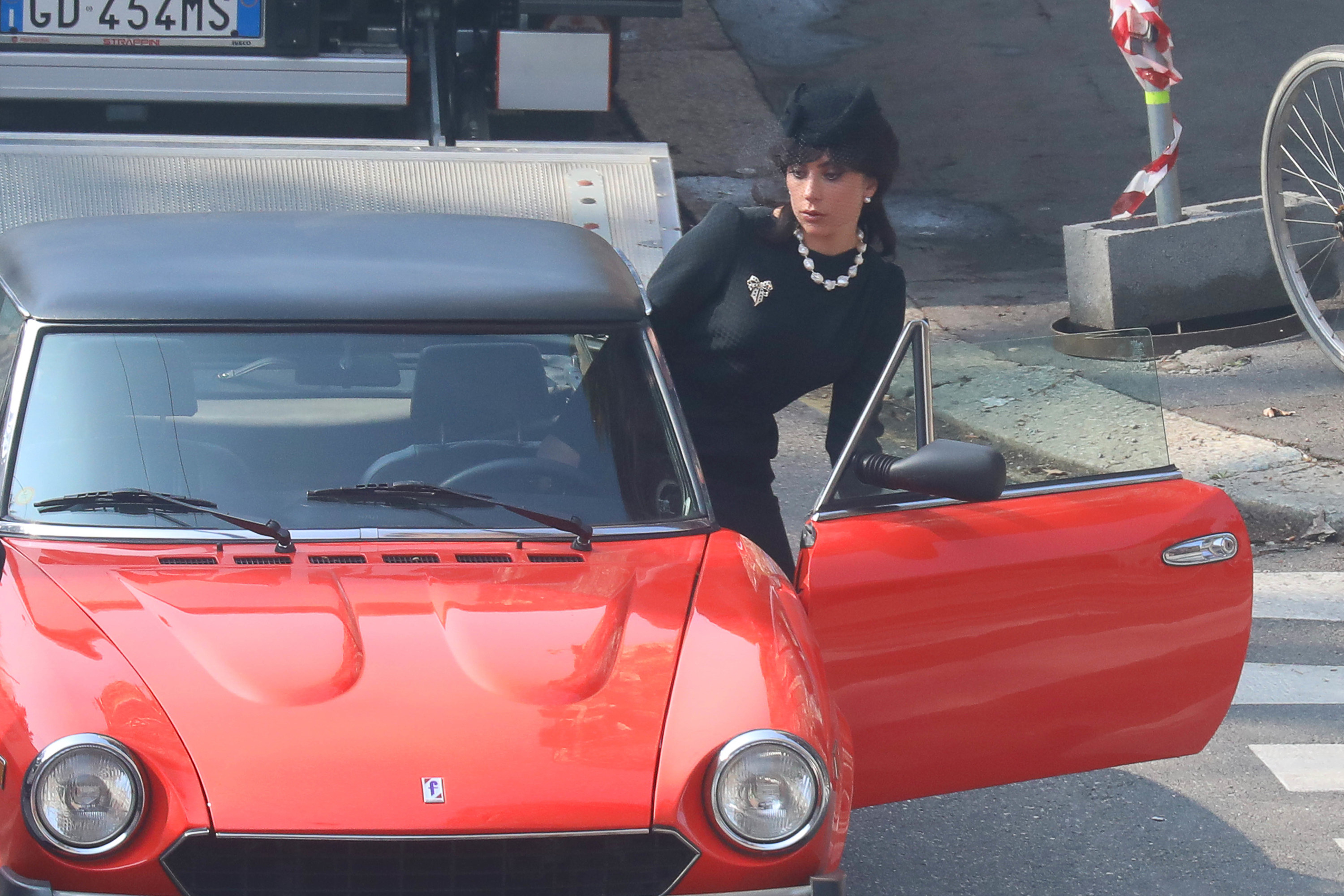 Gaga gets into a car while filming a scene in Italy