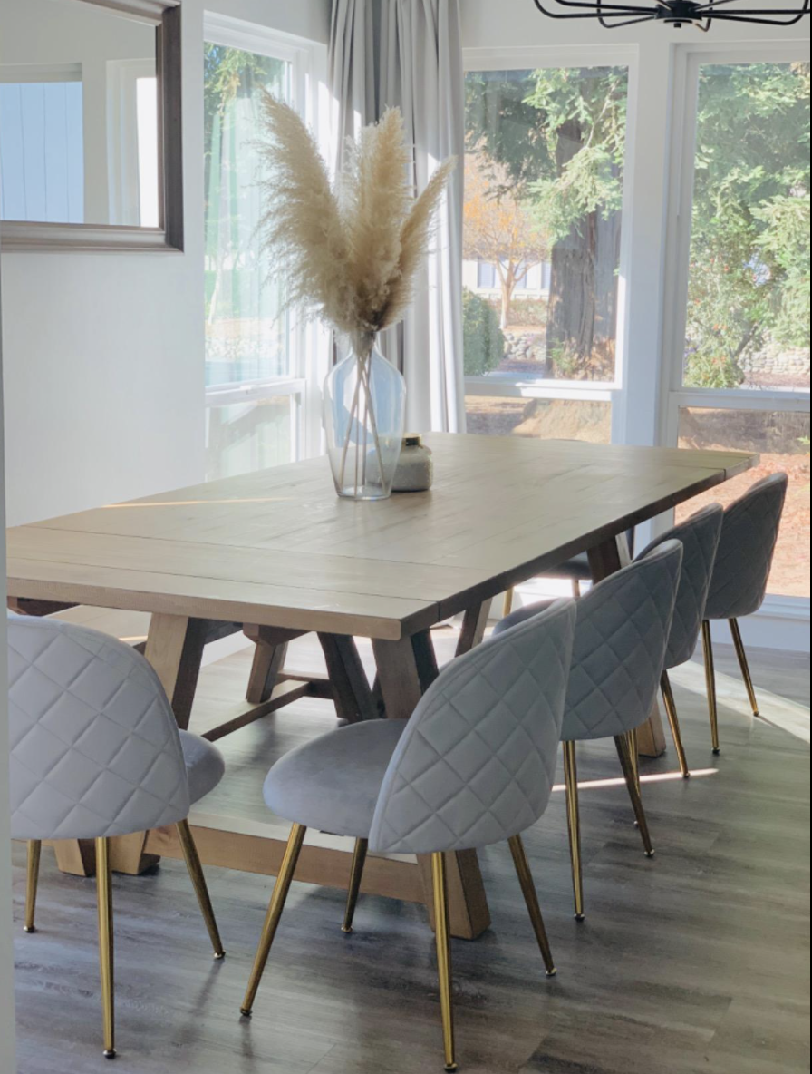 the gray velvet chairs at a long table