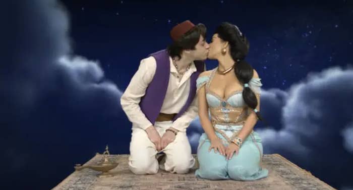 The two kissing in an Aladdin sketch on SNL