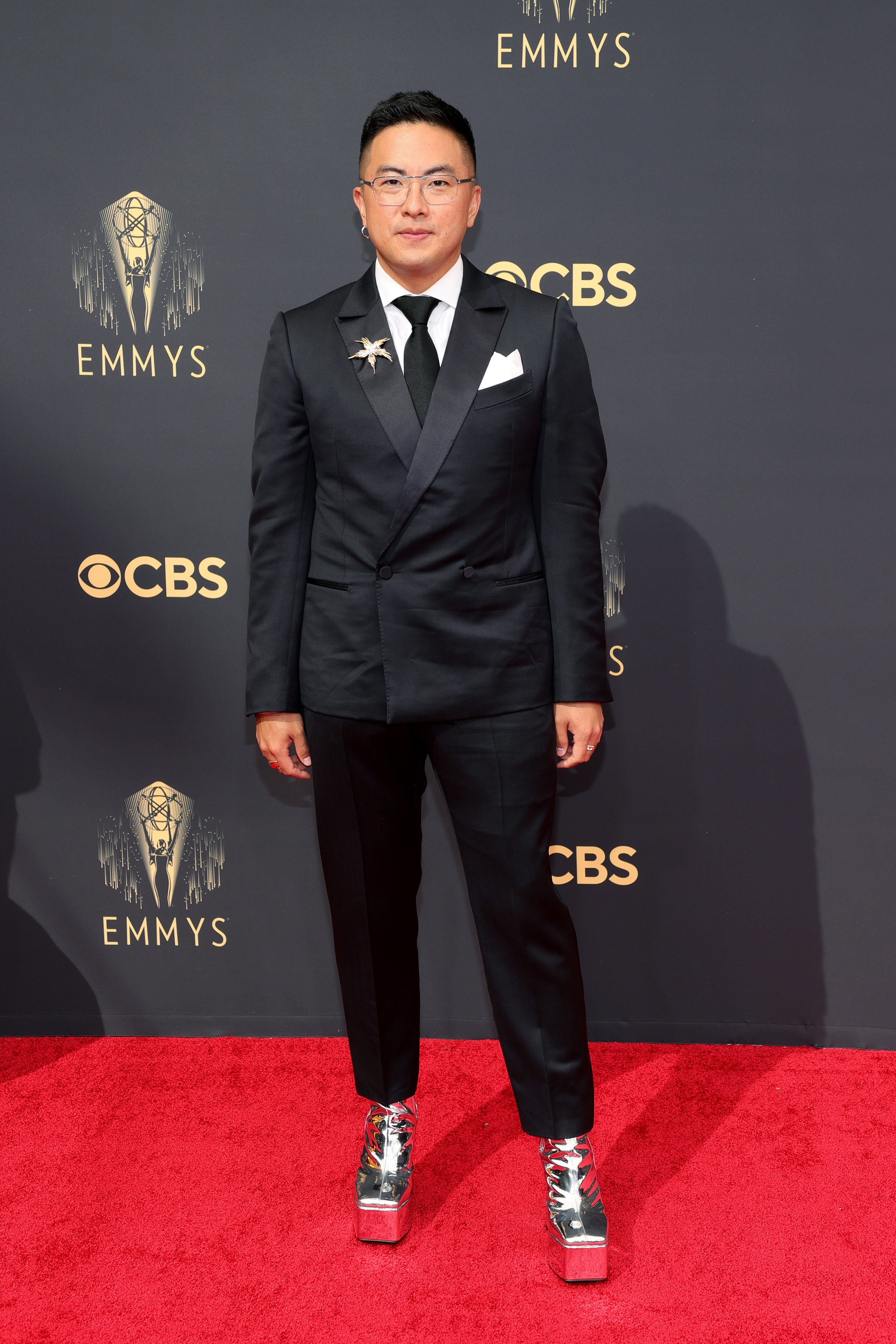 Bowen rocks a fitted suit and metallic platform boots at the Emmys