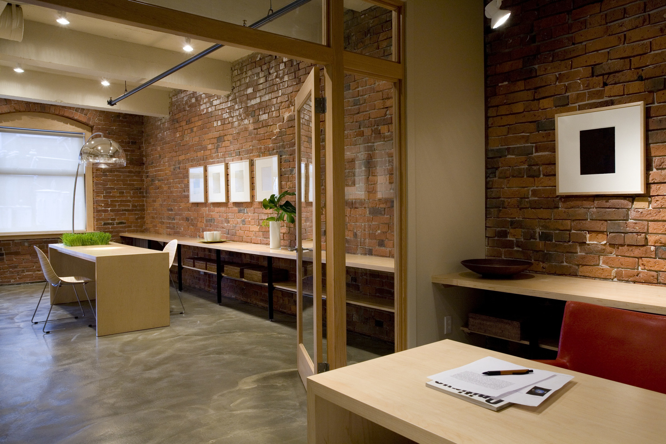 An office space with concrete floors