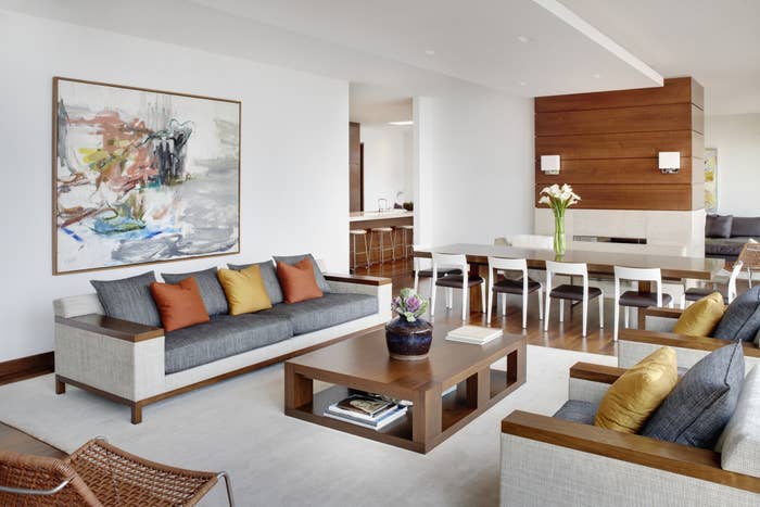 A modern living room that flows into the dining room