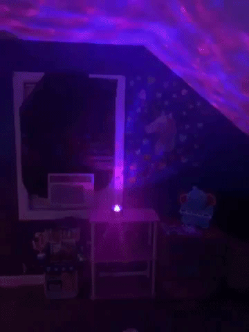 gif of the blue and purple galaxy light on a ceiling