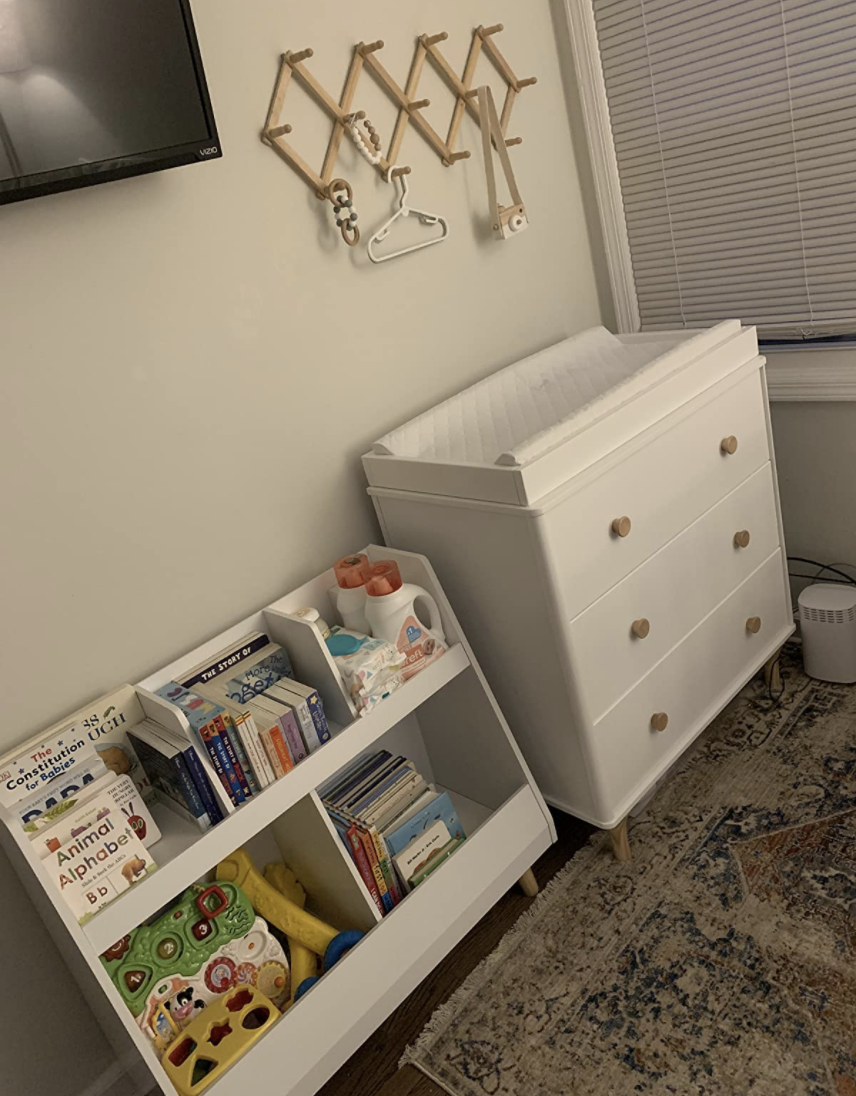a reviewer photo of the changing table dresser in white