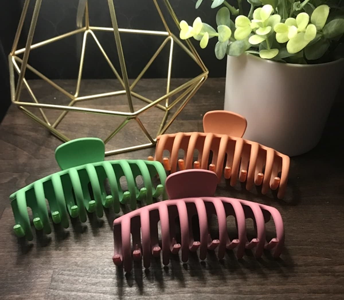 an orange, green, and pink claw clip