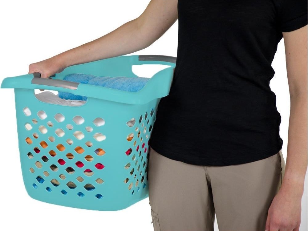 A 1.75-bushel plastic laundry hamper with three comfort-carry handles