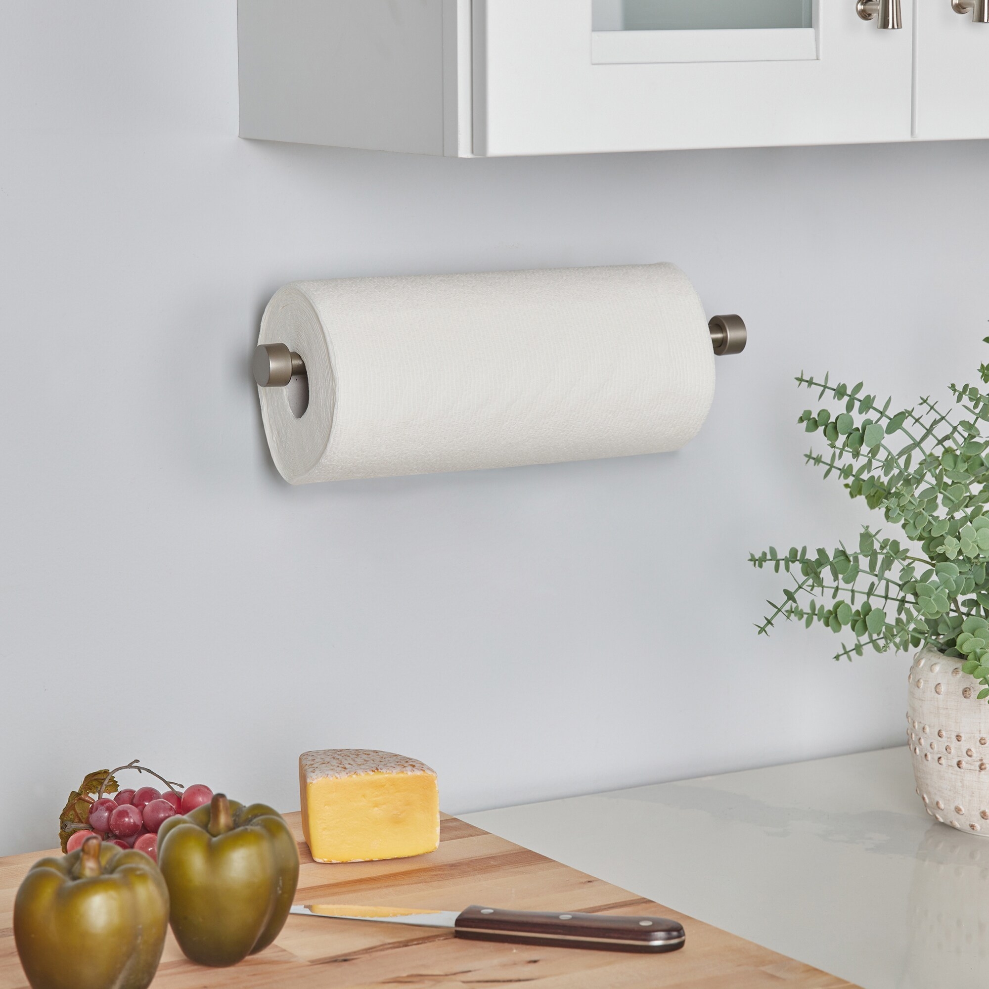 A metal nickel paper towel holder that can be wiped clean with a damp cloth