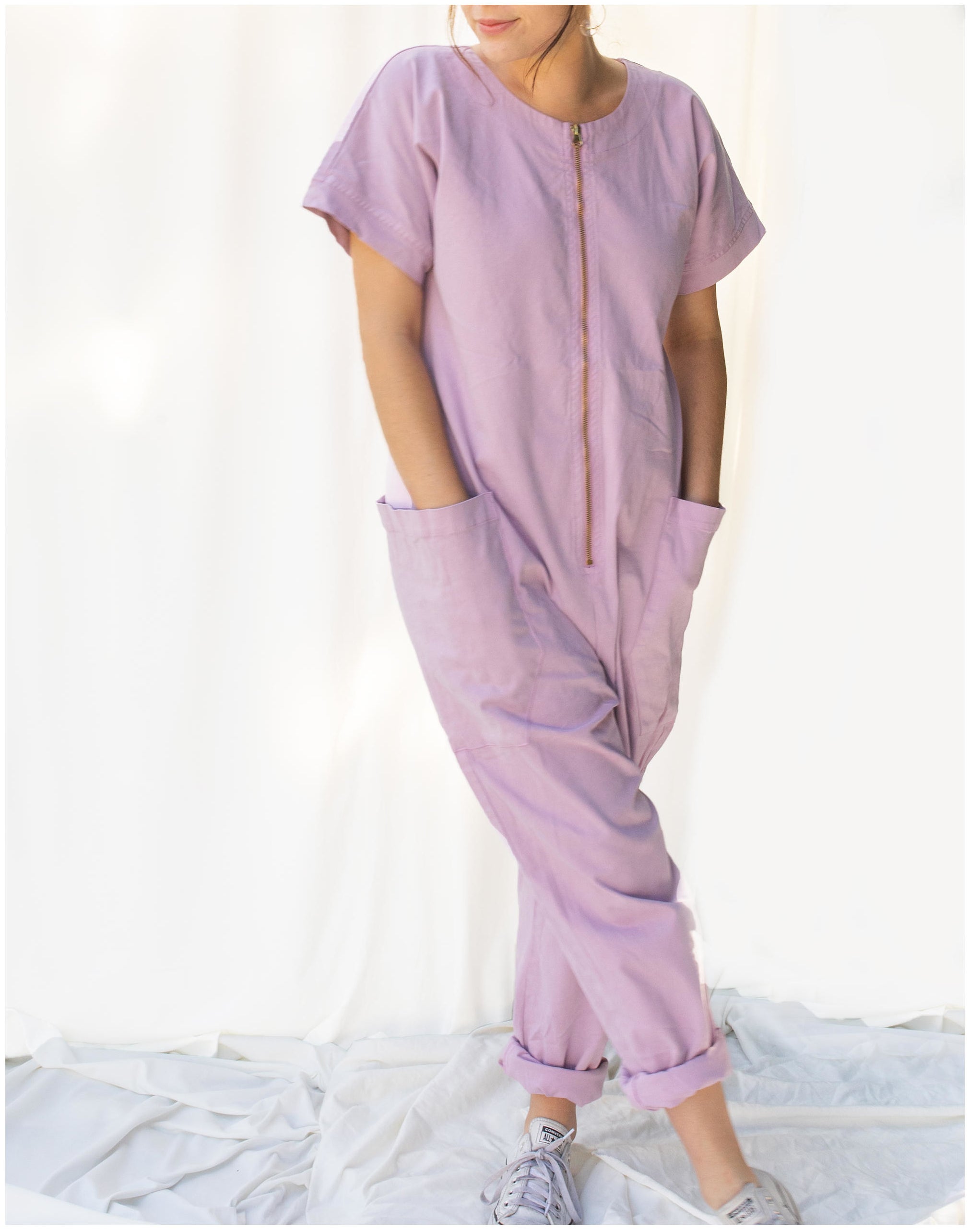 a model wearing the jumpsuit in lilac