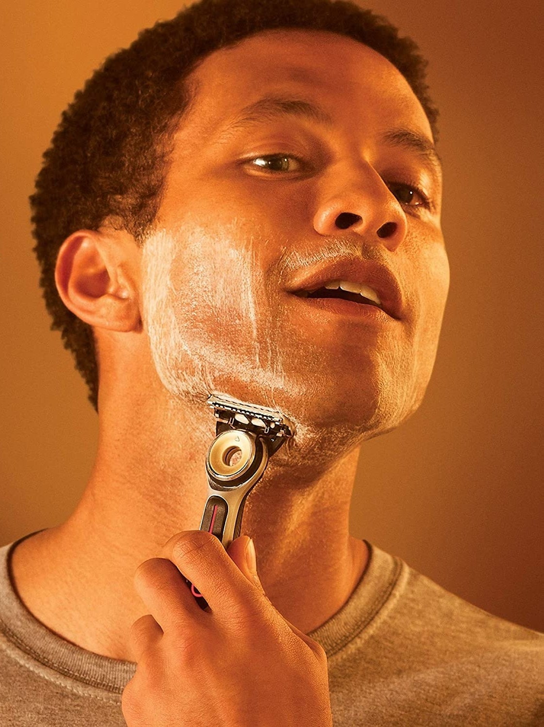 person shaving with the heated razor