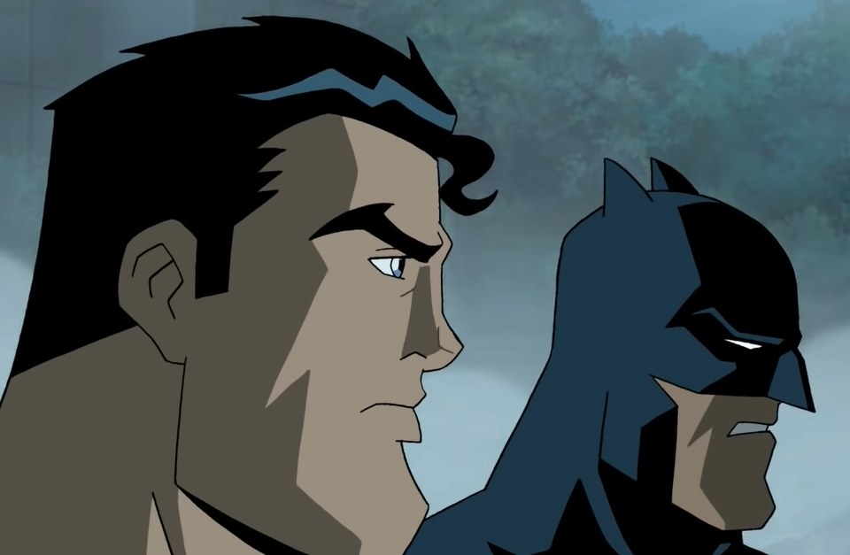 Superman and Batman looking as villains approach