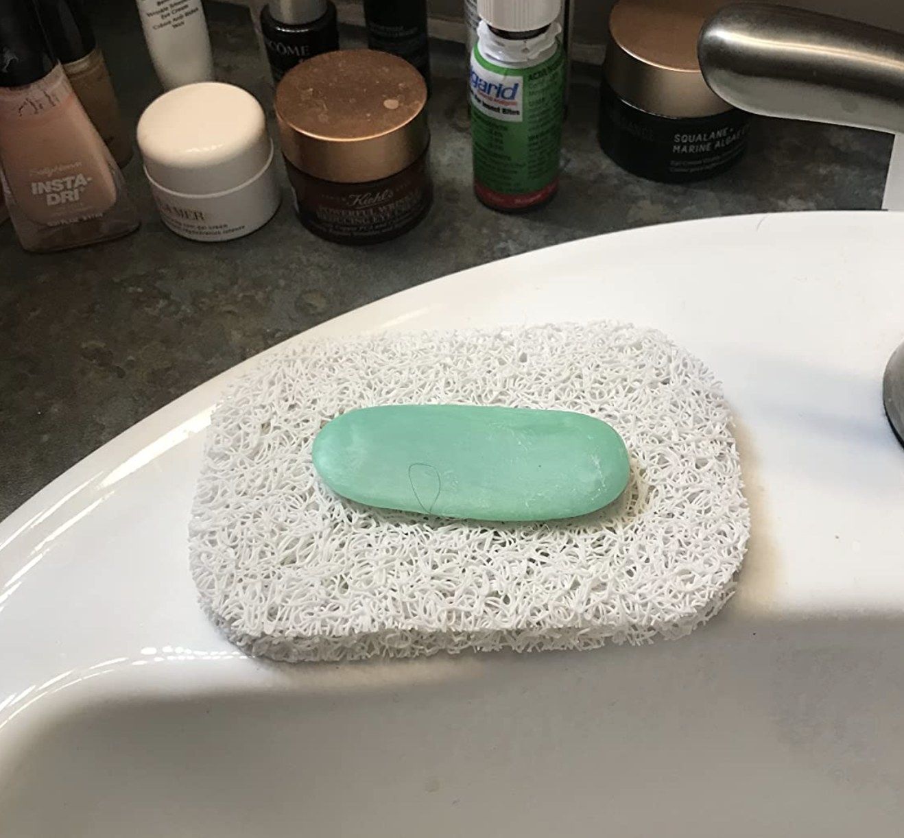 reviewer photo of soap resting on the soap saver
