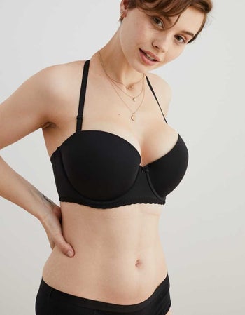 Model wearing black bra with straps