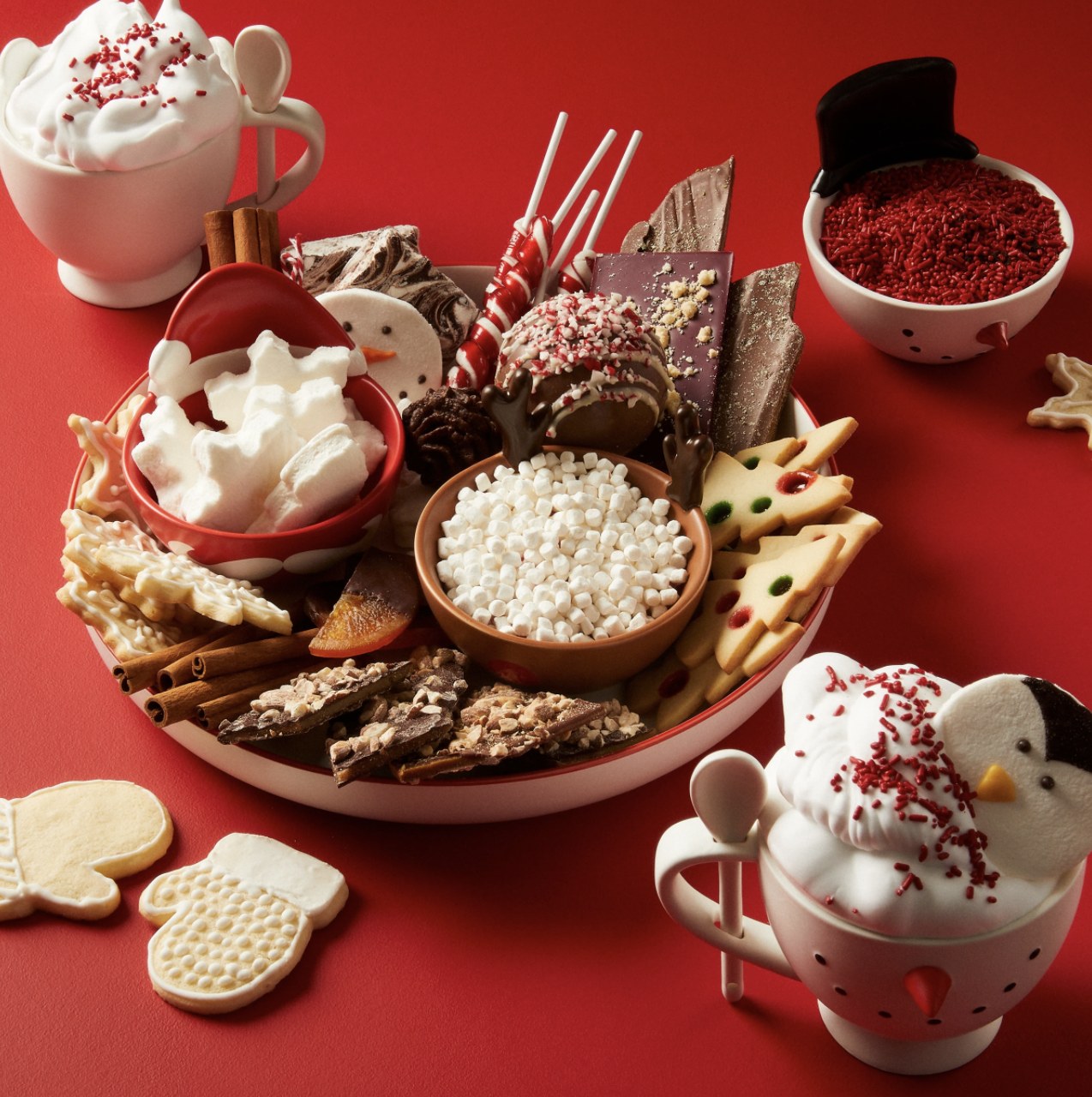 a hot cocoa making station with the four different toppings