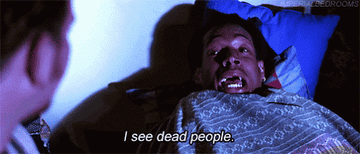 GIF man in bed saying i see dead people