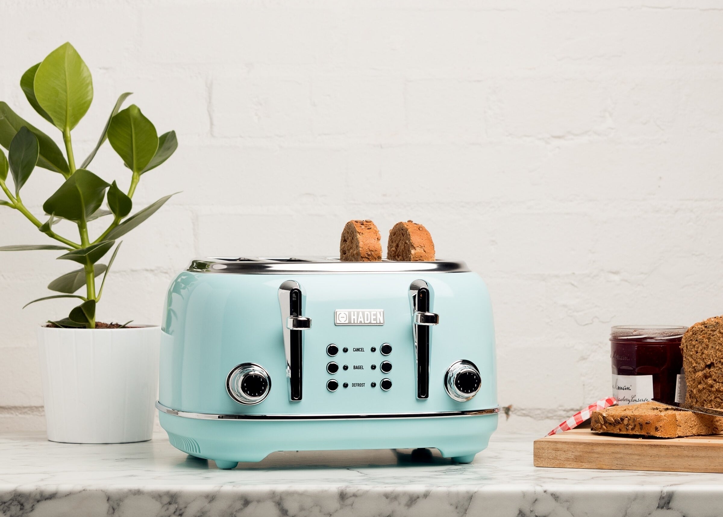 a four slice toaster in a pastel shade