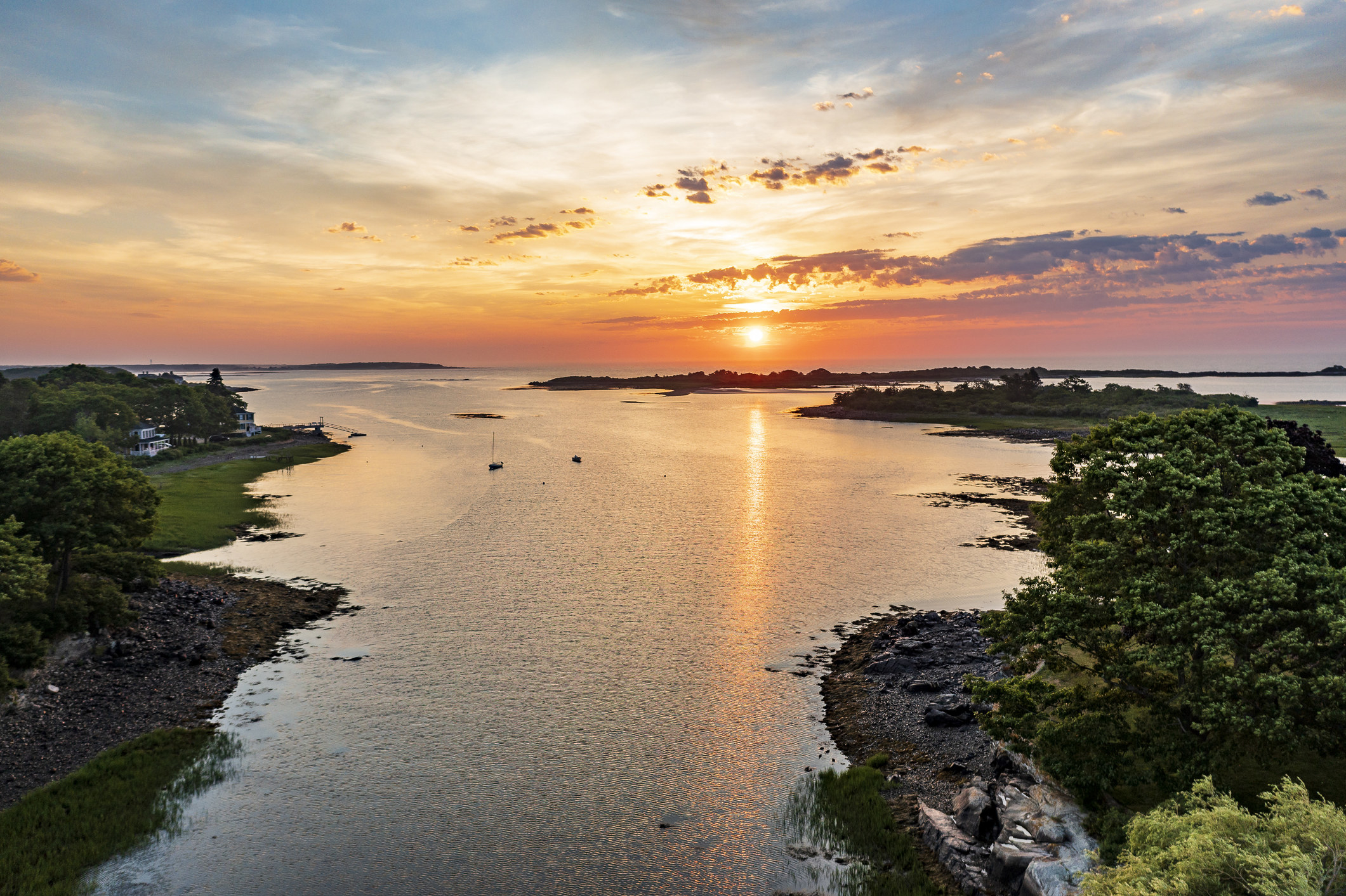 A scenic sunset over a cove