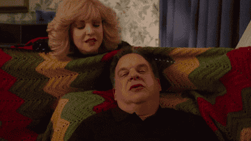 bev putting a blanket on her husband on the show &quot;the goldbergs&quot;