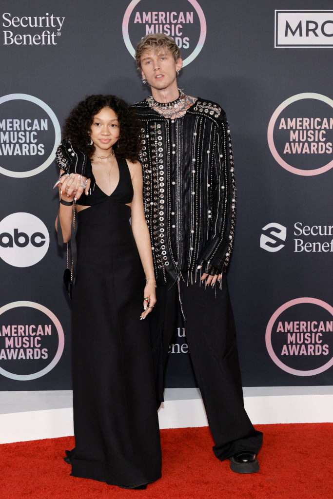 MGK wore a long chain inspired shirt and pants and his daughter wore a floor-length gown