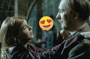 A close up of Nymphadora Tonks as she stands with her arms around Remus Lupin's neck