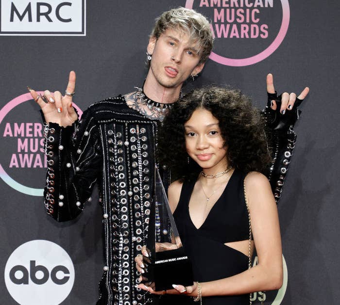 Machine Gun Kelly, winner of the Favorite Rock Artist award, poses with Casie Colson Baker in the Press Room at the 2021 American Music Awards