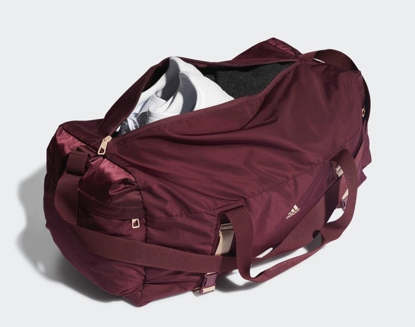 roomy red sports duffel with plenty of pockets on the front and side, and a shoulder strap
