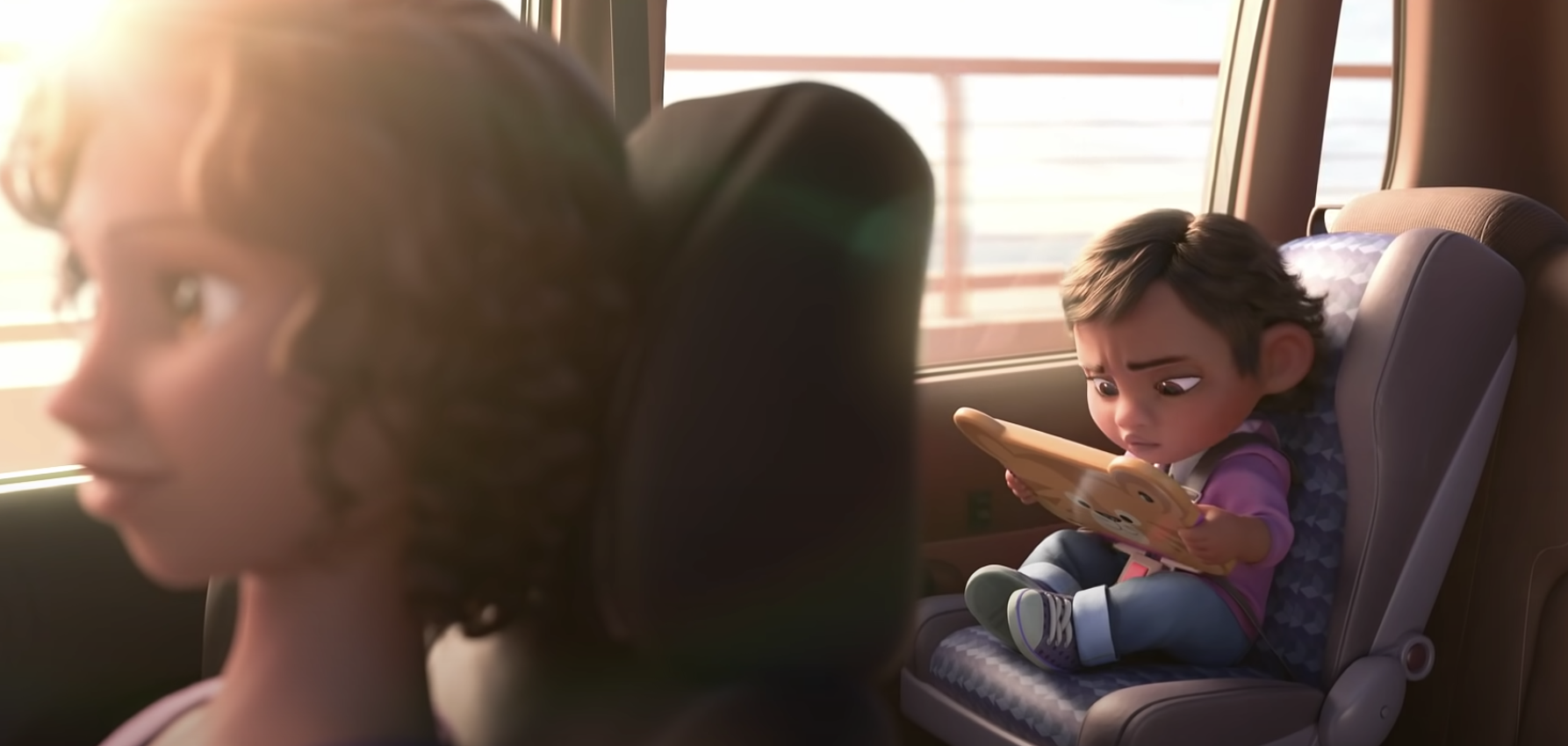 Character from Wreck-it Ralph holding tablet on bus