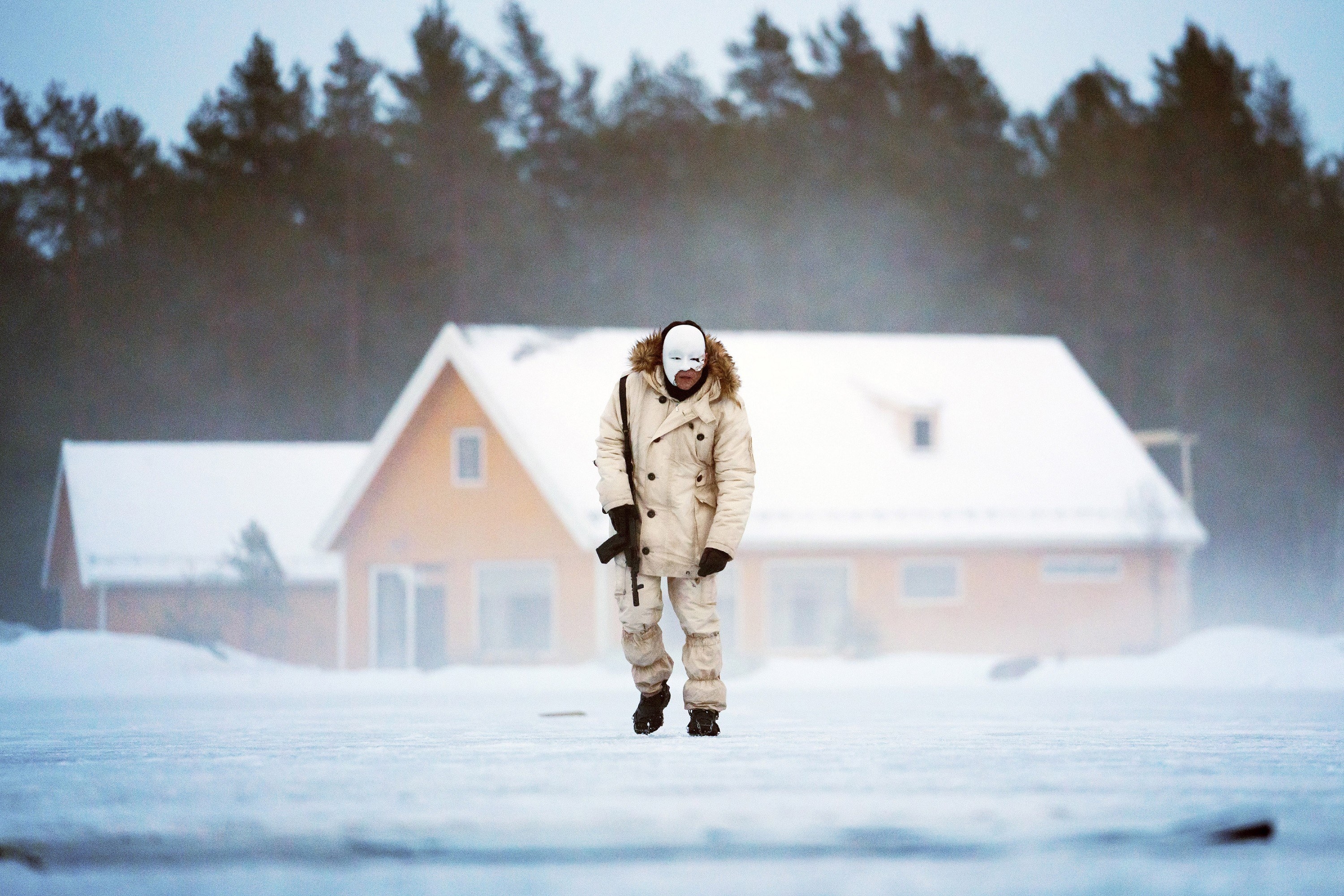 Safin in a snowsuit and the Noh mask
