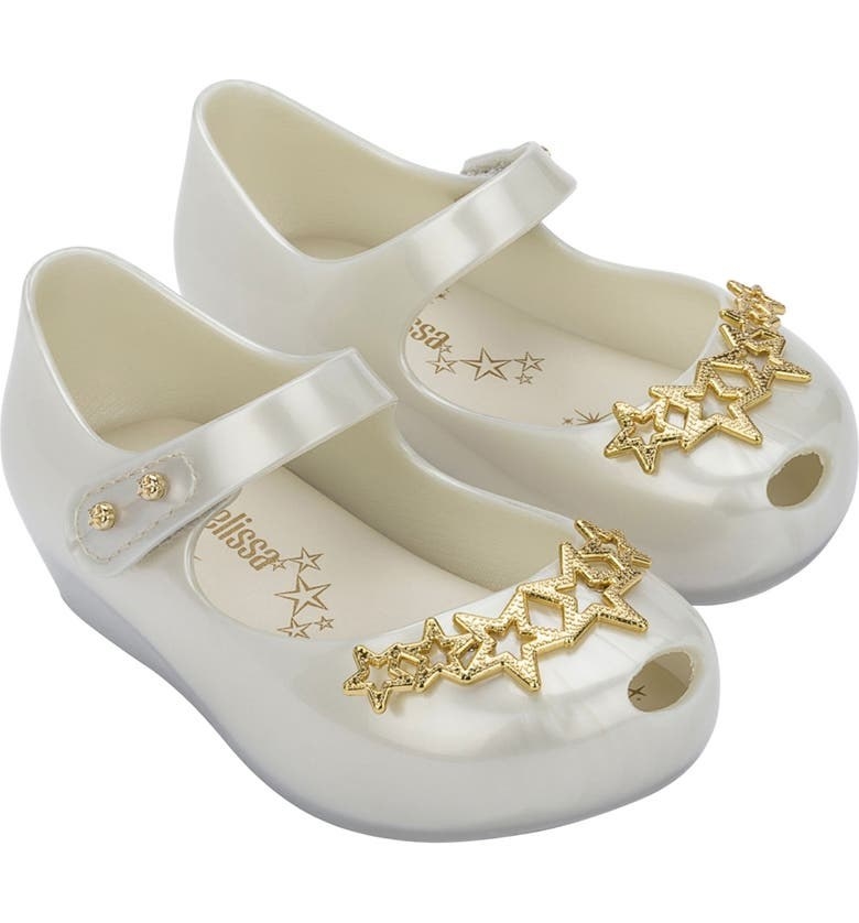 White sandals embellished with gold stars