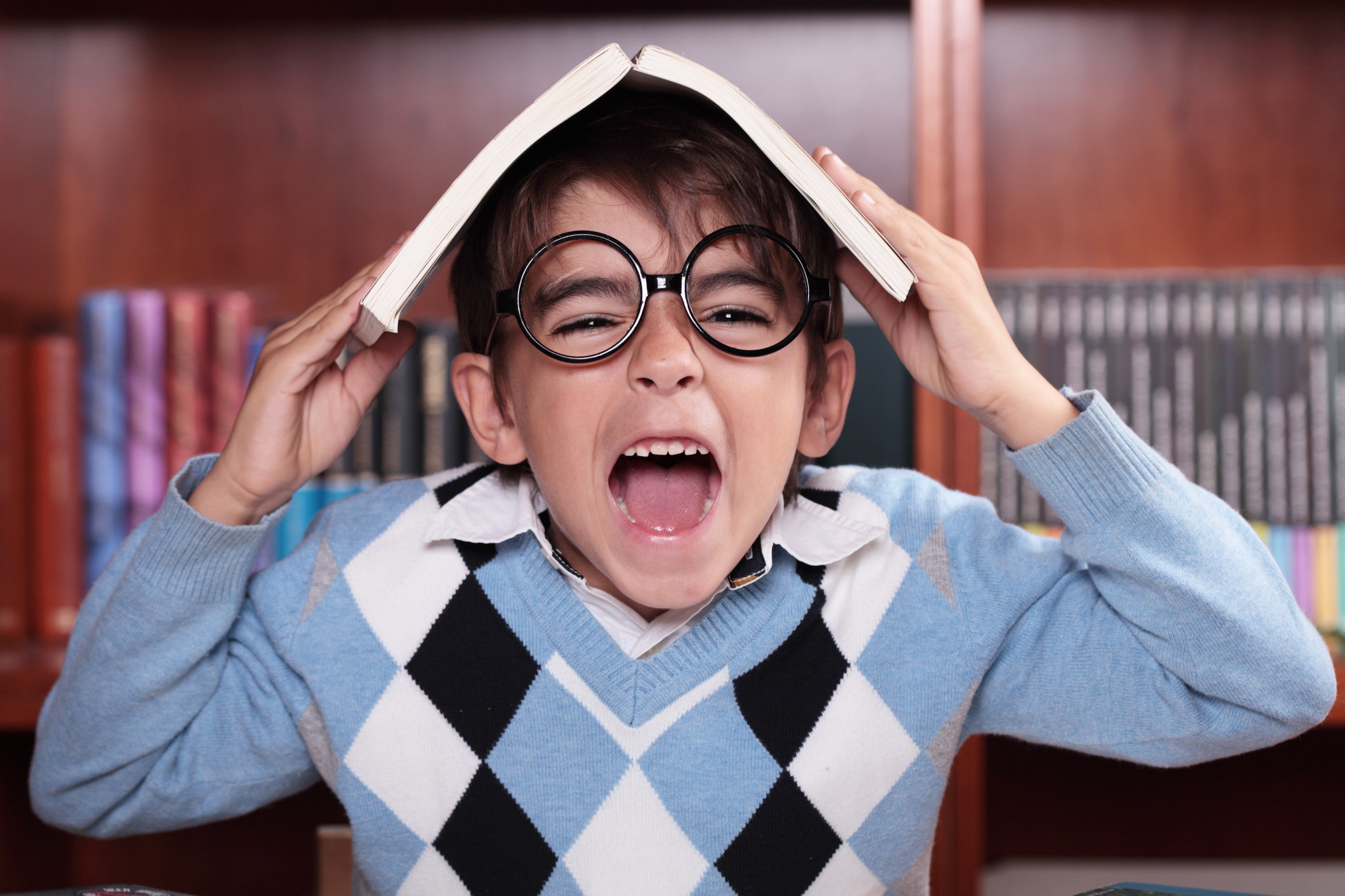 A young child screaming inside a library