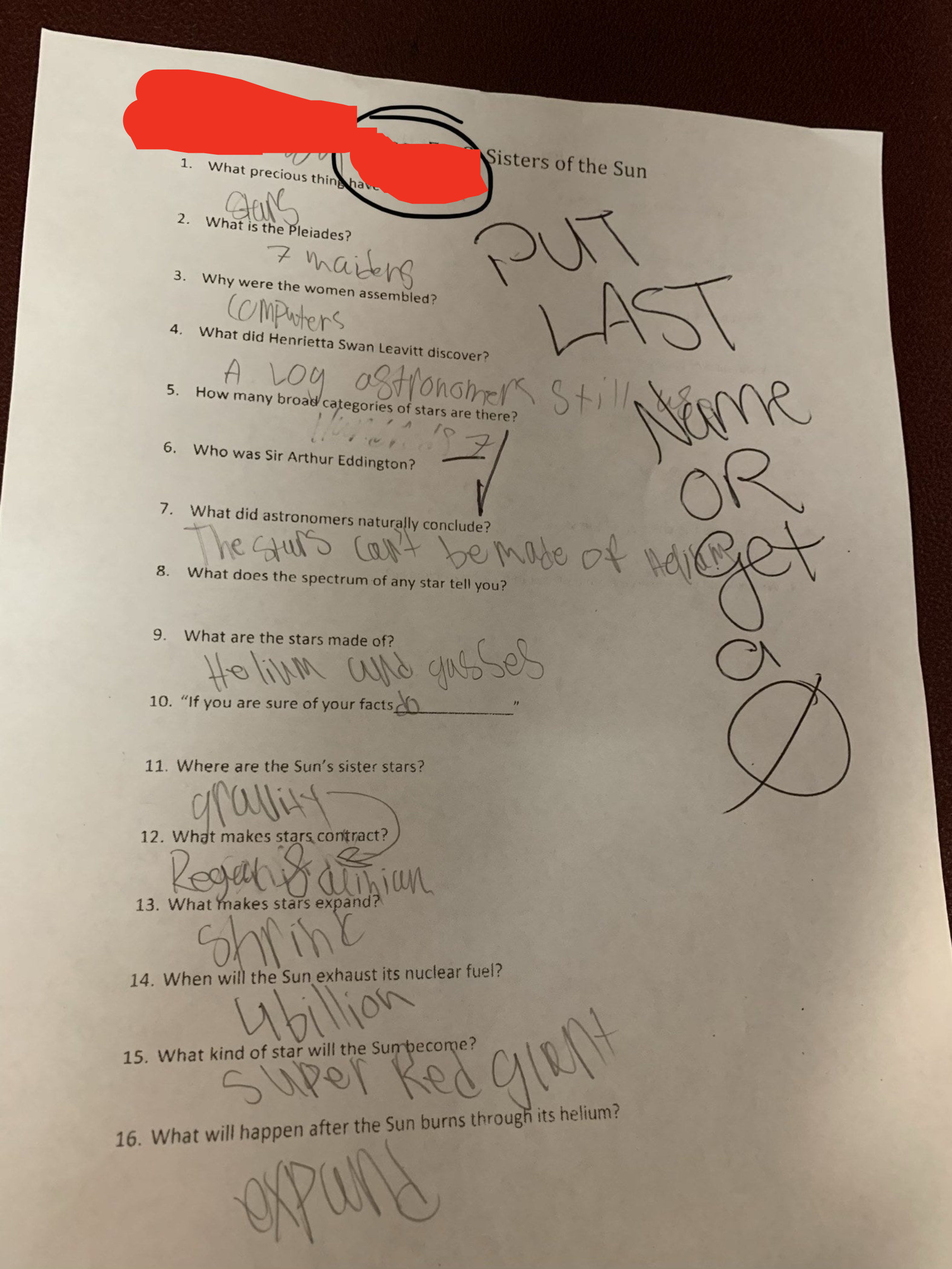 A teacher writing a note on a student&#x27;s assignment that reads: &quot;Put last name or get a 0&quot;