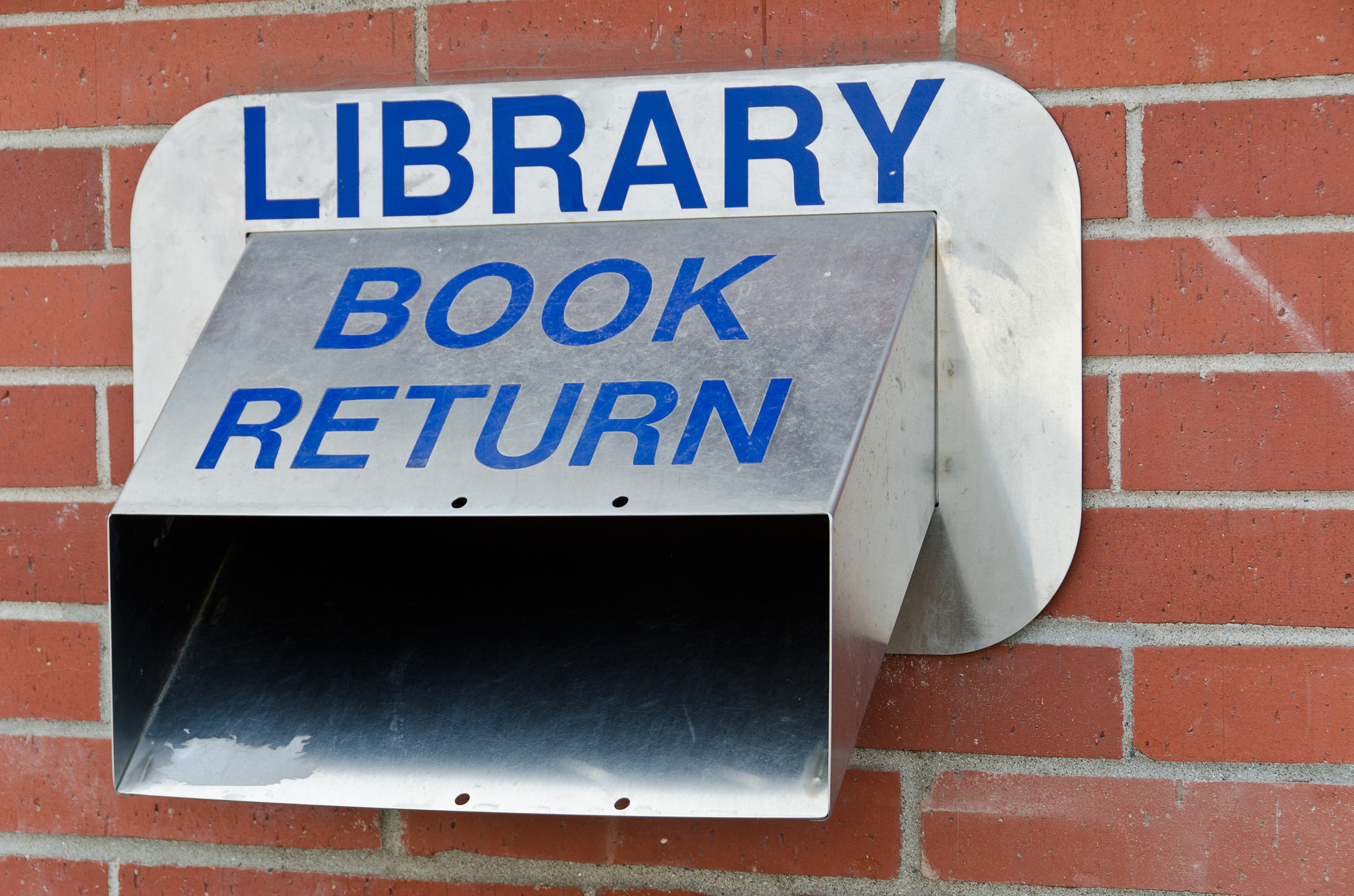 A meta book return slot outside a library