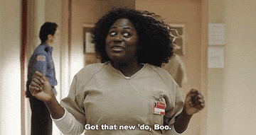 gif of danielle brooks as taystee in orange is the new black floofing her hair and saying &quot;got that new &#x27;do boo&quot;