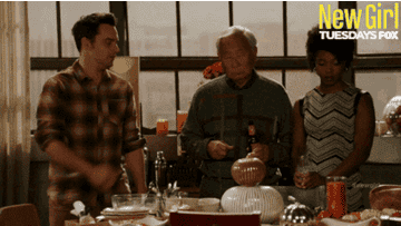 a gif of Nick from New Girl fist-bumping Tran