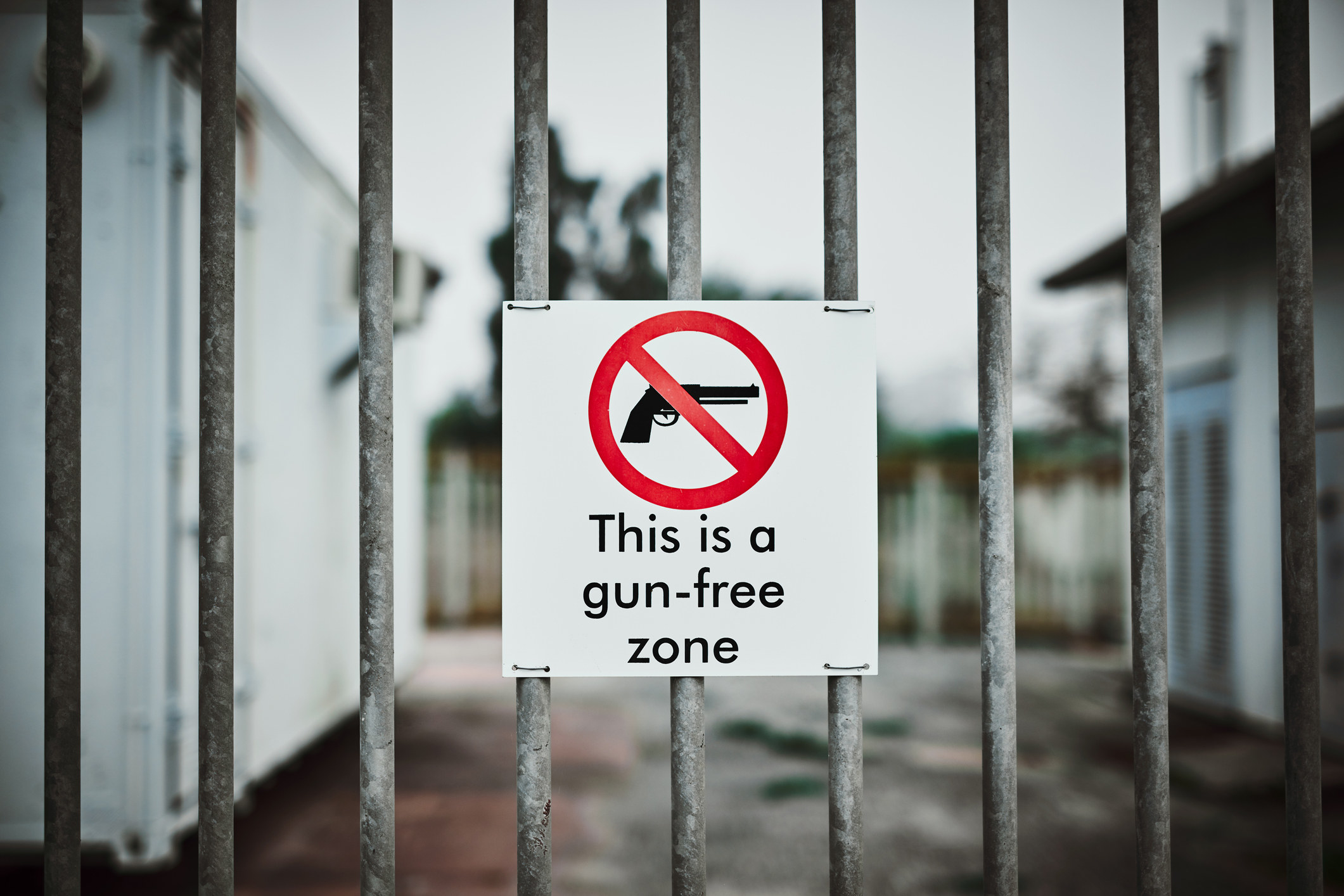 Sign on a fence: This is a gun-free zone
