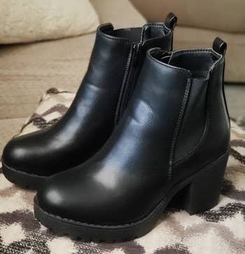 reviewer photo of a pair of black platform booties
