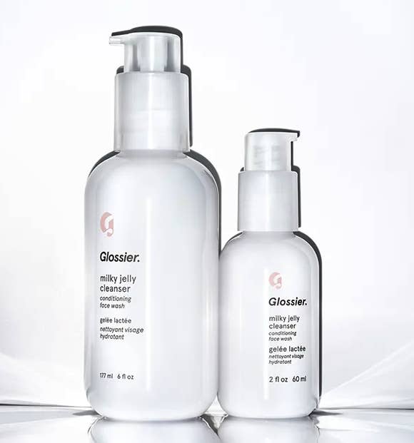 The full size and the mini size cleanser bottles sitting beside each other