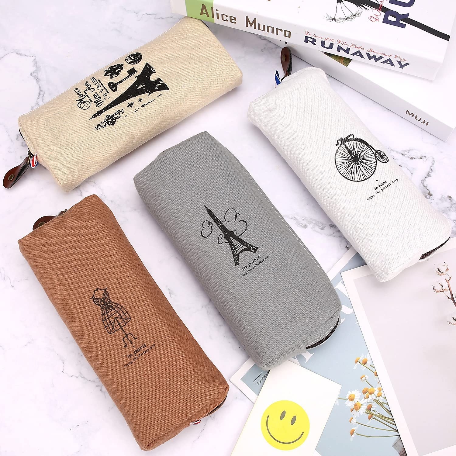 slim pencil pouches with Paris inspired designs on them