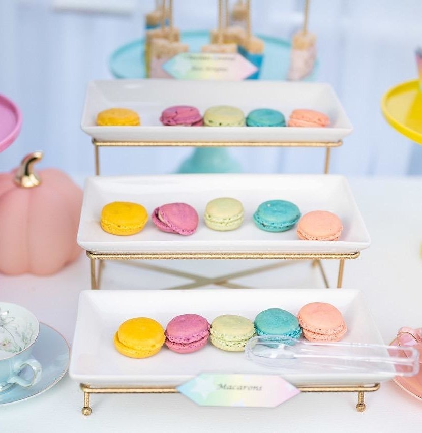 Reviewer photo of the gold serving platter holding colorful macarons