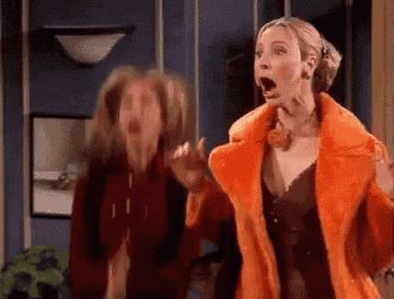 Gif of Rachel and Phoebe in &quot;Friends&quot; jumping and clapping